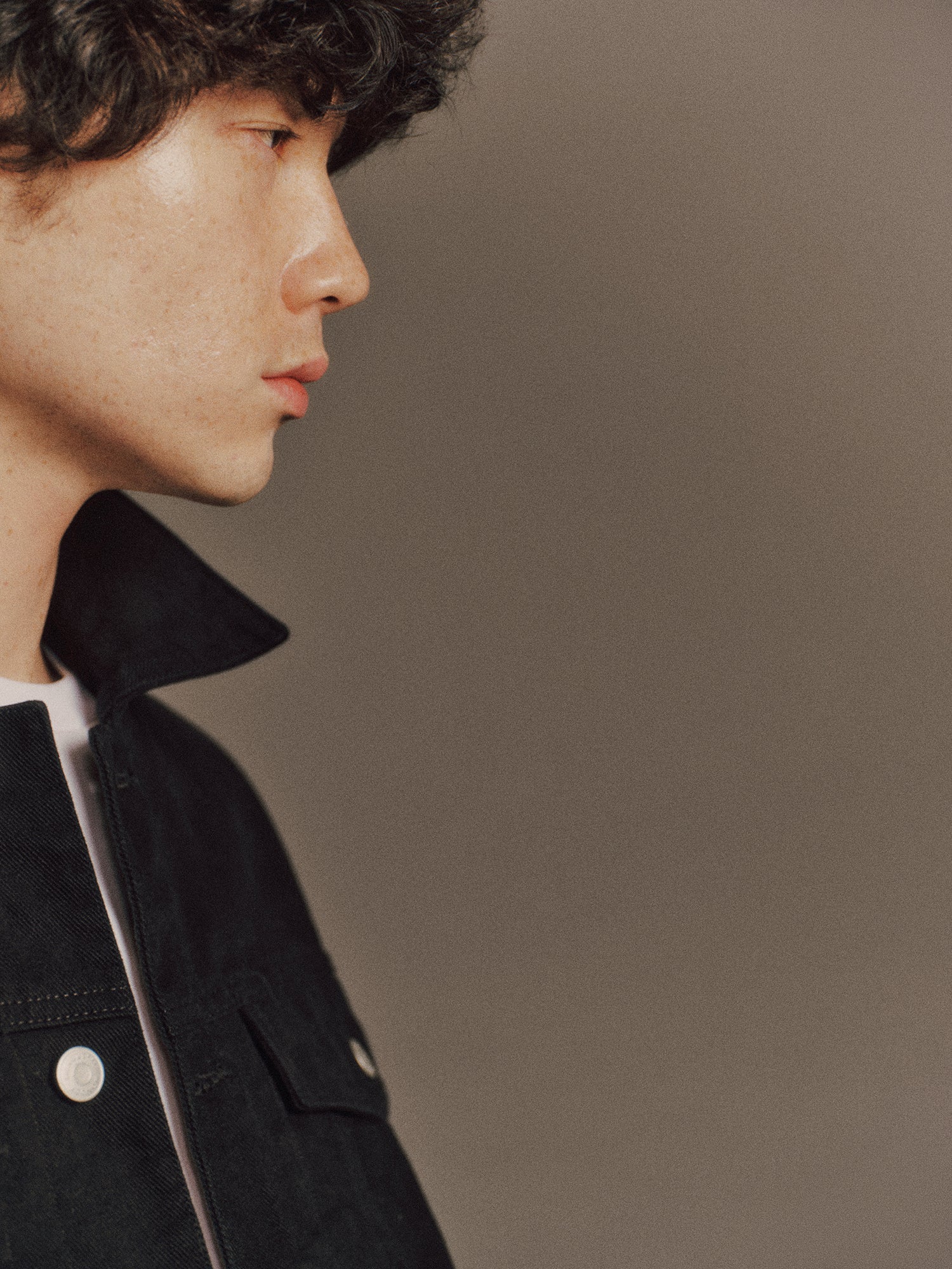 Émile wears Noel Jacket in Black, Denzel 
Top in White