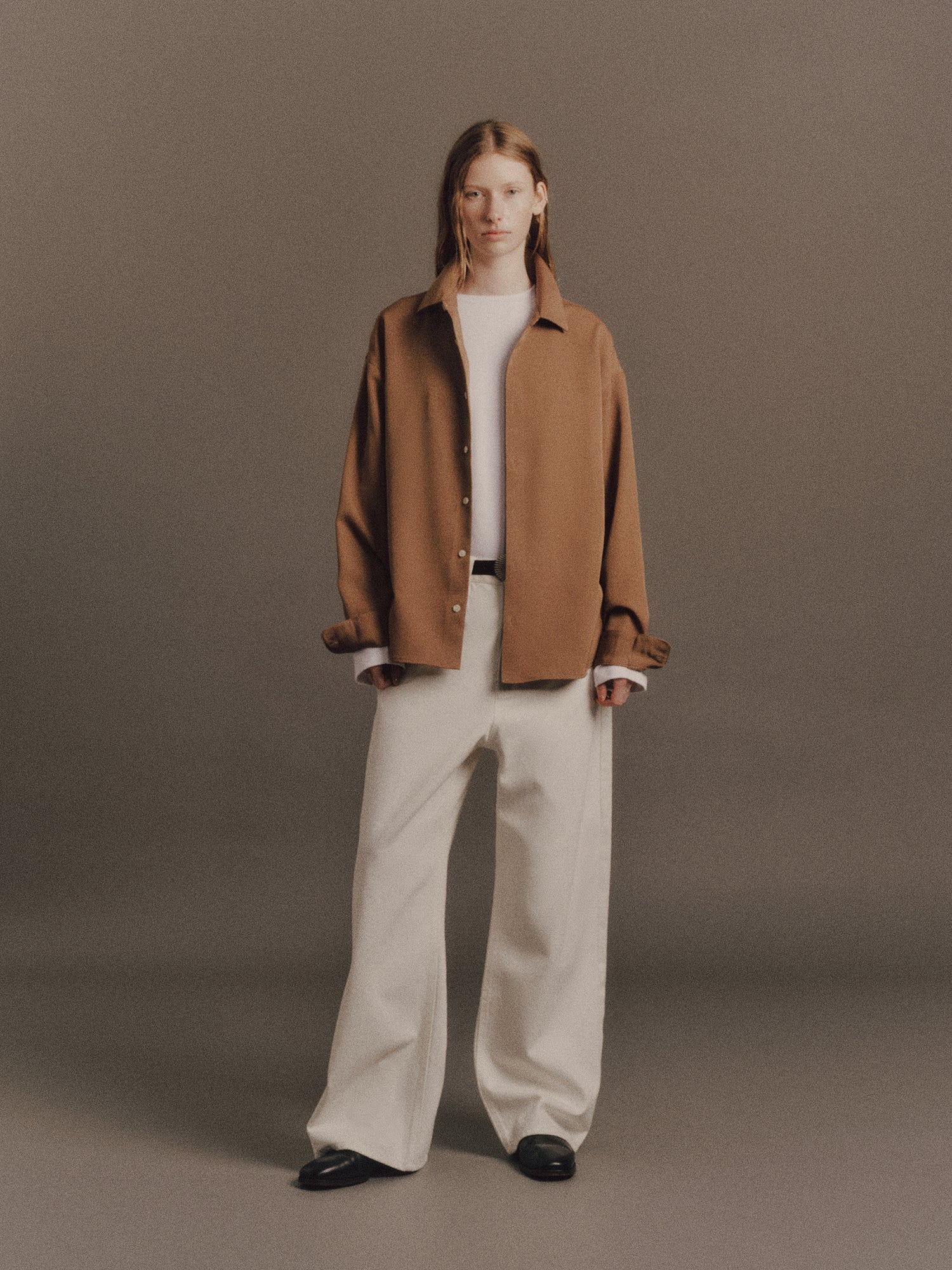 Tyla wears Ash Shirt in Brown, Denzel Top In White, Satie Jean In White, Shell Belt In Vintage Silver