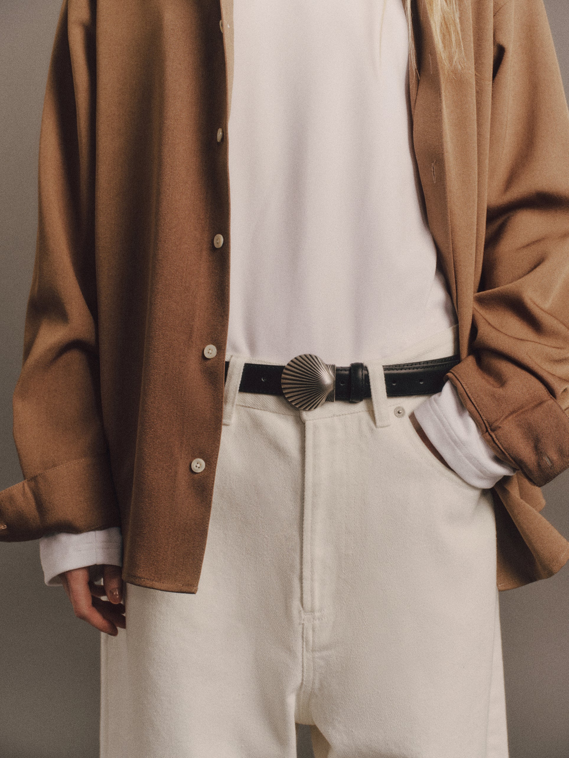 Tyla wears Ash Shirt in Brown, Denzel Top In White, Satie Jean In White, Shell Belt In Vintage Silver