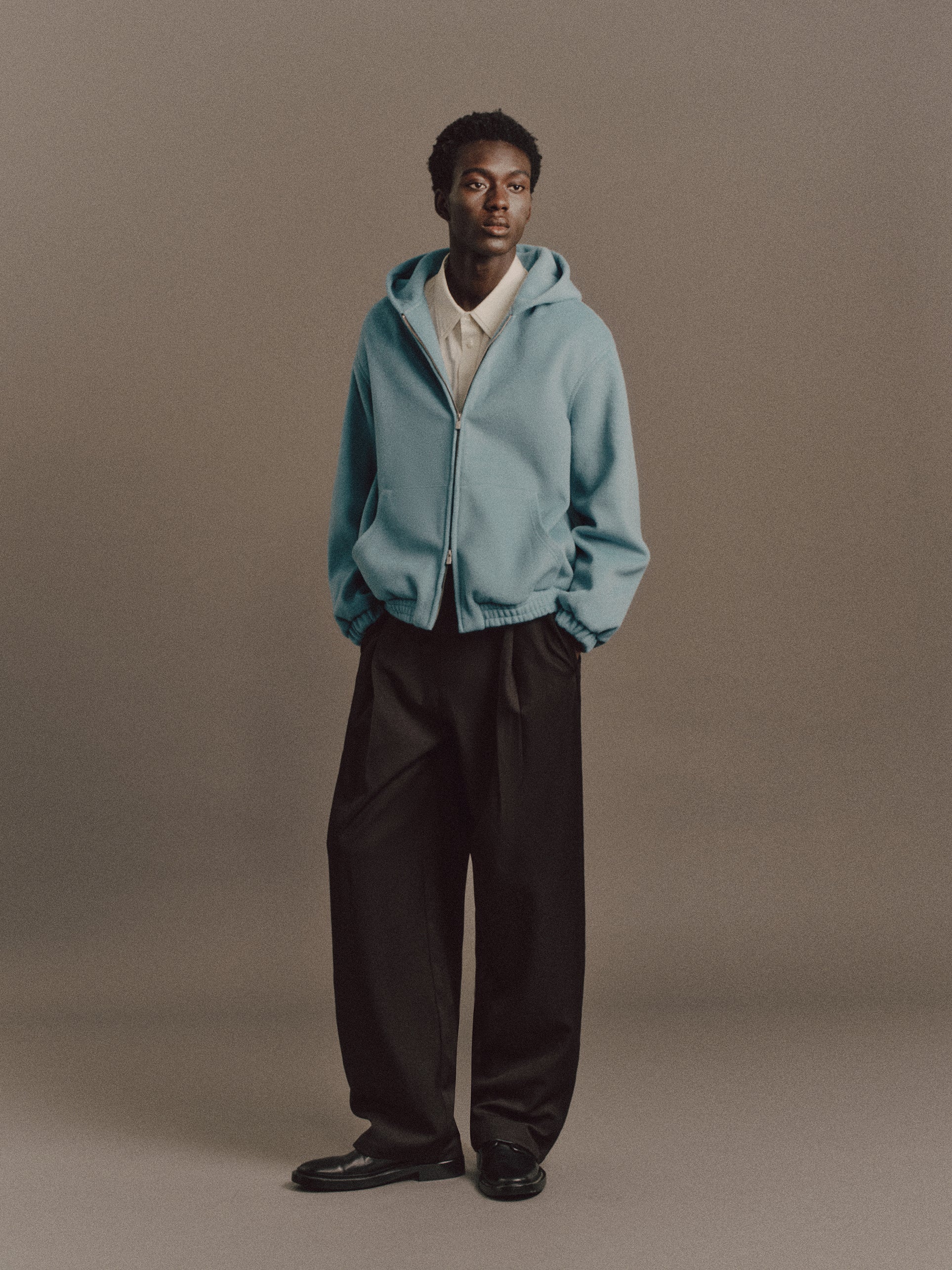 Muhamed wears Burt Shirt In Light Green, Kane Hoodie In Aqua Green, Carter Pant In Black